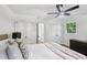 Bedroom with hardwood floors, ceiling fan, closet, and natural light at 2436 Ovidia Sw Cir, Atlanta, GA 30311