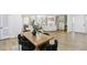 Open-concept dining room with kitchen, living room and updated flooring, enhancing the home's modern appeal at 2436 Ovidia Sw Cir, Atlanta, GA 30311