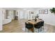 Open-concept dining and living area with updated flooring, enhancing the home's modern appeal at 2436 Ovidia Sw Cir, Atlanta, GA 30311