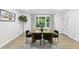 Stylish dining room with modern decor and large window, creating an elegant space for meals at 2436 Ovidia Sw Cir, Atlanta, GA 30311