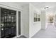 Welcoming entryway with a freshly painted brick facade with a black door, creating a bright, clean aesthetic at 2436 Ovidia Sw Cir, Atlanta, GA 30311