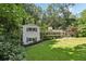 Charming two-story home with a lush, green lawn and mature trees at 2436 Ovidia Sw Cir, Atlanta, GA 30311