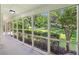 Relaxing screened porch with views of the landscaped yard, offering a peaceful outdoor living space at 2436 Ovidia Sw Cir, Atlanta, GA 30311