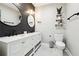 Modern bathroom features dual sinks, elegant wood accent wall, and contemporary fixtures for a sleek design at 4710 Robins Nest Ln, Cumming, GA 30041