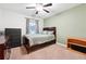 Comfortable bedroom featuring a bed, ceiling fan and neutral walls for a relaxing atmosphere at 4710 Robins Nest Ln, Cumming, GA 30041