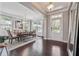 Elegant dining room with hardwood floors, large windows, stylish chandelier, and ample natural light at 4710 Robins Nest Ln, Cumming, GA 30041