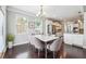 Dining area with abundant natural light, open to the kitchen and living room at 4710 Robins Nest Ln, Cumming, GA 30041