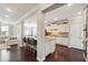 Spacious kitchen with dark hardwood floors, a center island with seating, and ample cabinet space at 4710 Robins Nest Ln, Cumming, GA 30041