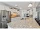Gourmet kitchen featuring stainless steel appliances, granite counters and white cabinetry at 4710 Robins Nest Ln, Cumming, GA 30041
