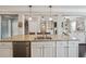 Open kitchen with a large island, granite countertops, stainless steel appliances, and white cabinets at 4710 Robins Nest Ln, Cumming, GA 30041