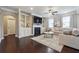 Cozy living room featuring a fireplace, built-in bookshelves, and a comfortable sofa at 4710 Robins Nest Ln, Cumming, GA 30041
