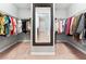 Well-organized walk-in closet with ample hanging space, providing plenty of storage for clothing and accessories at 4710 Robins Nest Ln, Cumming, GA 30041