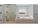 Bright bathroom features a separate shower and soaking tub at 4203 Norbury Ct, Smyrna, GA 30080