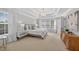This light-filled bedroom features a tray ceiling and neutral decor at 4203 Norbury Ct, Smyrna, GA 30080