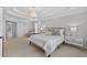 This primary bedroom features neutral colors, a tray ceiling, and plush carpet at 4203 Norbury Ct, Smyrna, GA 30080