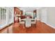 Eat-in kitchen featuring stainless appliances, hardwood floors, cherry cabinets, and granite countertops at 4203 Norbury Ct, Smyrna, GA 30080