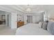 Bright primary bedroom featuring a tray ceiling, wood floors, and an ensuite bathroom at 4203 Norbury Ct, Smyrna, GA 30080