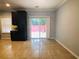 Dining area with tile flooring, dark cabinets, access to outdoor patio, and great natural light at 4645 Valais Ct # 10, Johns Creek, GA 30022