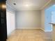 Bright dining room with tile floors, neutral walls, and sliding glass doors for access to outdoor space at 4645 Valais Ct # 10, Johns Creek, GA 30022