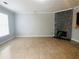 Living room with tile floors, fireplace, large window, and access to the kitchen area at 4645 Valais Ct # 10, Johns Creek, GA 30022