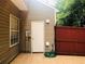 Cozy outdoor patio features tile flooring and a wood privacy fence at 4645 Valais Ct # 10, Johns Creek, GA 30022