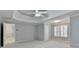 Large primary bedroom featuring natural light, en suite bathroom and walk-in closet access at 5015 Riverthur Pl, Peachtree Corners, GA 30096