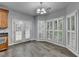 Bright breakfast area with hardwood floors and windows, French doors and white shutters at 5015 Riverthur Pl, Peachtree Corners, GA 30096