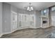Bright and airy living room with lots of natural light, hardwood floors, and a fireplace at 5015 Riverthur Pl, Peachtree Corners, GA 30096