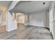 An open-concept living area showcases hardwood flooring and natural light with plantation shutters at 5015 Riverthur Pl, Peachtree Corners, GA 30096