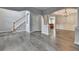 View of the open living area showing hardwood floors, stairs, and entry to other rooms at 5015 Riverthur Pl, Peachtree Corners, GA 30096