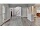 Spacious living room with hardwood floors and neutral paint at 5015 Riverthur Pl, Peachtree Corners, GA 30096