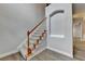 Foyer staircase with hardwood floors and natural lighting at 5015 Riverthur Pl, Peachtree Corners, GA 30096