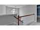 Staircase leading to the second floor with carpet and railing at 5015 Riverthur Pl, Peachtree Corners, GA 30096