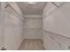 Spacious walk-in closet with built-in wire shelving and carpeted floor at 5015 Riverthur Pl, Peachtree Corners, GA 30096