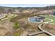 Aerial showing walkway, pond, amphitheater, and construction areas at 5575 Mirror Lake Dr, Cumming, GA 30028