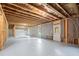 Unfinished basement with concrete floor and exposed ceiling at 5575 Mirror Lake Dr, Cumming, GA 30028