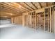 Unfinished basement with concrete floor and exposed ceiling at 5575 Mirror Lake Dr, Cumming, GA 30028