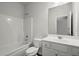 Bright bathroom with a tub-shower combination and a vanity with ample storage at 5575 Mirror Lake Dr, Cumming, GA 30028