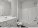 This bathroom features a shower and tub combo with a single sink at 5575 Mirror Lake Dr, Cumming, GA 30028