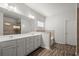 This bathroom features a double sink vanity and a separate shower at 5575 Mirror Lake Dr, Cumming, GA 30028