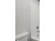 Clean bathroom with a shower-tub combination, toilet, and showerhead at 5575 Mirror Lake Dr, Cumming, GA 30028