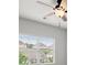 Bedroom with a view, ceiling fan, and plenty of natural light at 5575 Mirror Lake Dr, Cumming, GA 30028