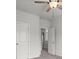 Cozy bedroom featuring carpeted floors and a double door closet at 5575 Mirror Lake Dr, Cumming, GA 30028