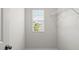 Walk-in closet featuring a window for natural light and ample wire shelving at 5575 Mirror Lake Dr, Cumming, GA 30028