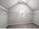 Spacious walk-in closet with ample shelving and natural light from a window at 5575 Mirror Lake Dr, Cumming, GA 30028