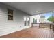 Covered wooden deck area outside of a home at 5575 Mirror Lake Dr, Cumming, GA 30028