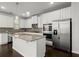 Stylish kitchen featuring stainless steel appliances, granite counters, and island at 5575 Mirror Lake Dr, Cumming, GA 30028