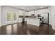 Modern kitchen with stainless steel appliances, granite countertops, and island at 5575 Mirror Lake Dr, Cumming, GA 30028