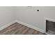 Small laundry room features hard floors and white walls at 5575 Mirror Lake Dr, Cumming, GA 30028