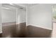 Spacious living room with dark hardwood flooring at 5575 Mirror Lake Dr, Cumming, GA 30028